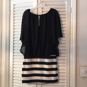 BCX Dress with billowing draped sleeves.